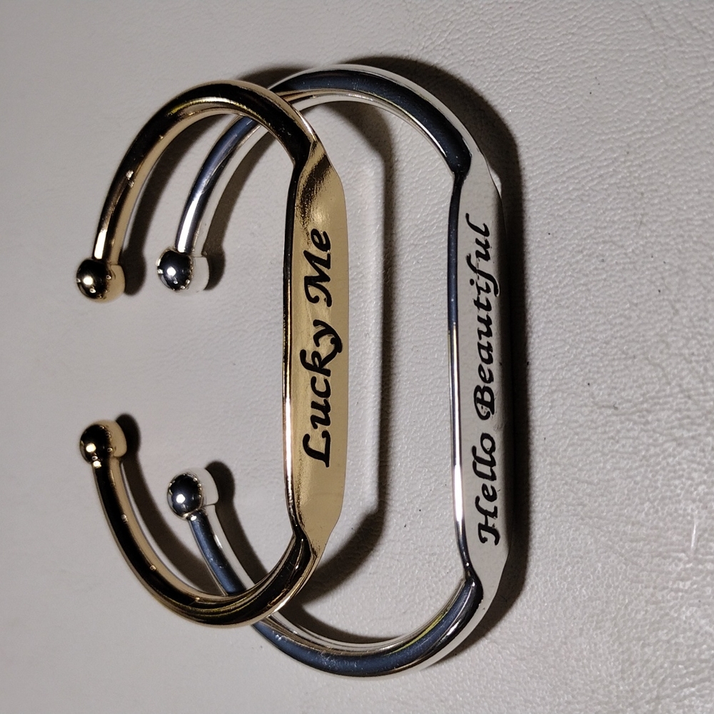 Pair of Metal Inspiration bracelet.